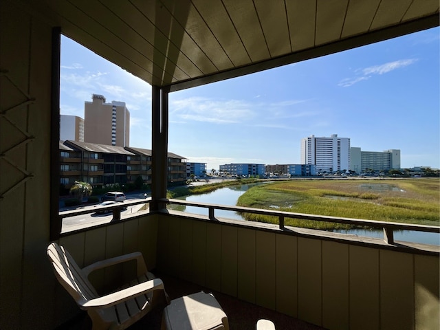 balcony featuring a water view