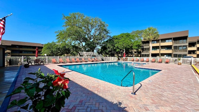 view of swimming pool with a patio area