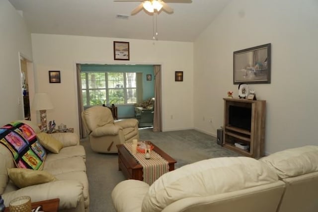 living room featuring carpet floors, vaulted ceiling, and ceiling fan