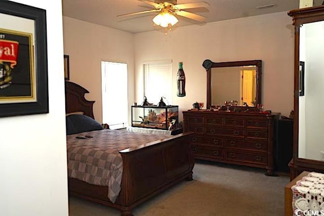 bedroom featuring light carpet and ceiling fan