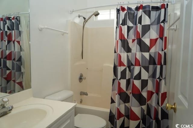 full bathroom with vanity, shower / tub combo with curtain, and toilet