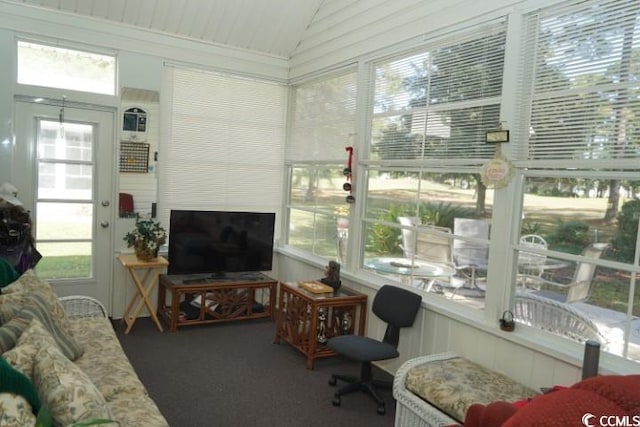 sunroom featuring vaulted ceiling