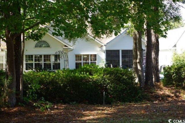 exterior space featuring a sunroom