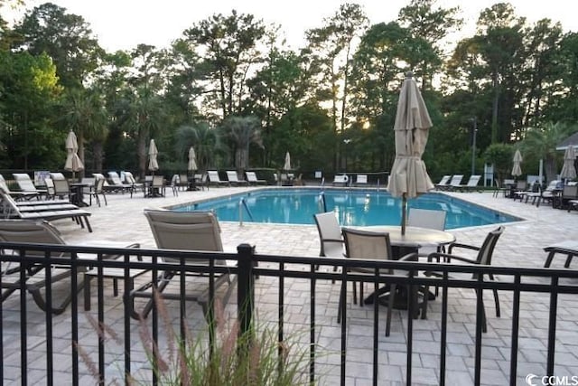 view of pool featuring a patio area