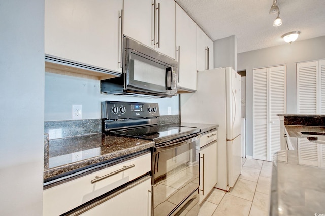 4337 Spa Dr Unit 1309, Little River, SC 29566 - kitchen featuring black appliances, white cabinets, light tile patterned floors, and a textured ceiling