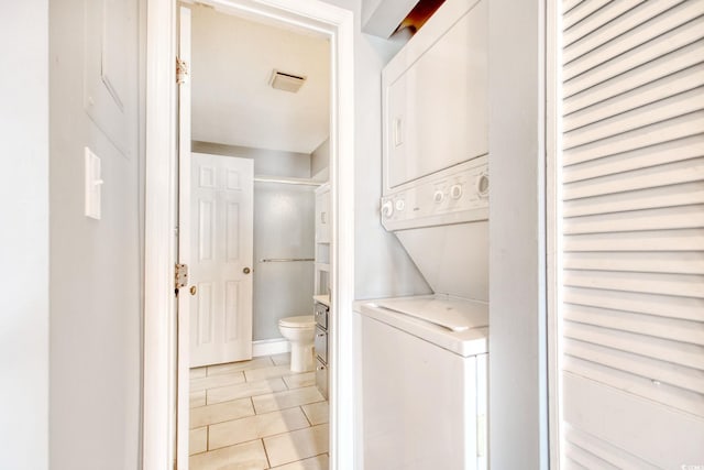 4337 Spa Dr Unit 1309, Little River, SC 29566 - washroom with estacked washer and dryer and light tile patterned flooring