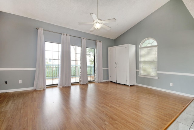 4337 Spa Dr Unit 1309, Little River, SC 29566 - unfurnished room featuring ceiling fan, healthy amount of natural light, high vaulted ceiling, and light wood-type flooring