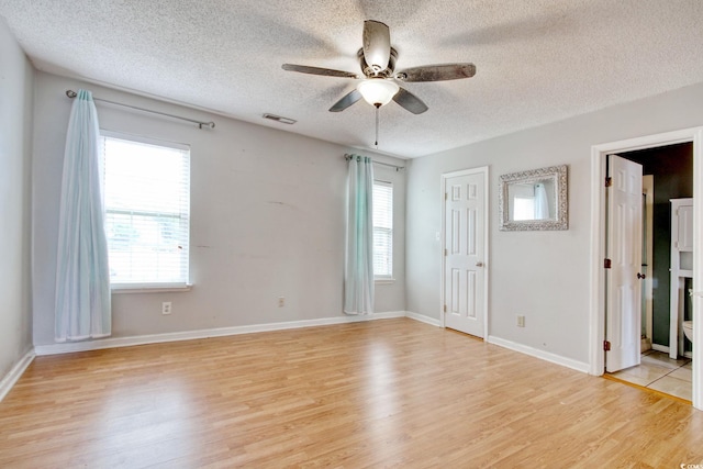 4337 Spa Dr Unit 1309, Little River, SC 29566 - spare room featuring a textured ceiling, light wood-type flooring, and ceiling fan