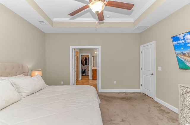 bedroom featuring ornamental molding, a raised ceiling, light colored carpet, and ceiling fan