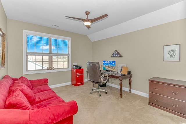 carpeted home office with ceiling fan and vaulted ceiling