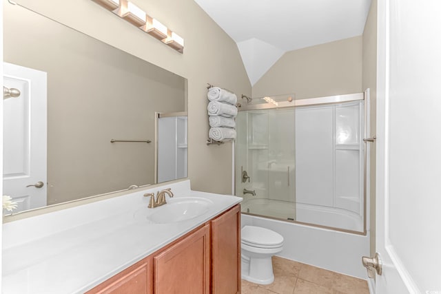 full bathroom featuring lofted ceiling, combined bath / shower with glass door, toilet, vanity, and tile patterned flooring