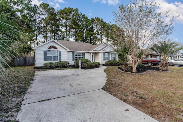 single story home featuring a front lawn