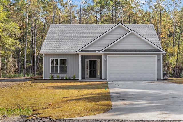 view of front facade with a garage and a front lawn