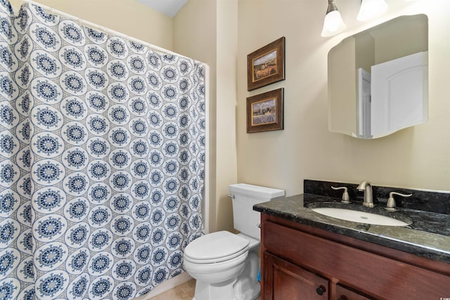 bathroom with vanity, tile patterned floors, and toilet