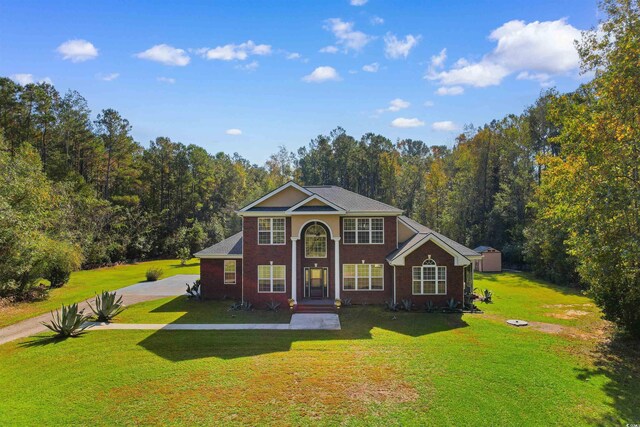 view of front of home with a front lawn