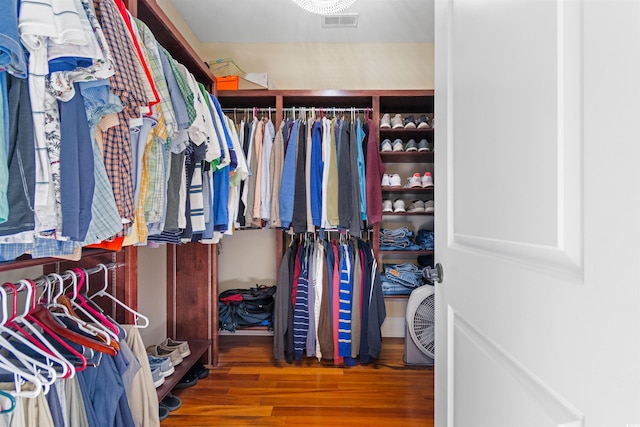 spacious closet featuring hardwood / wood-style flooring