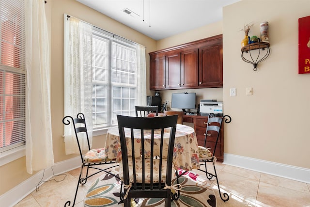 tiled dining area with a healthy amount of sunlight