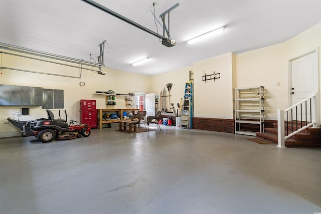 garage with electric panel and a garage door opener