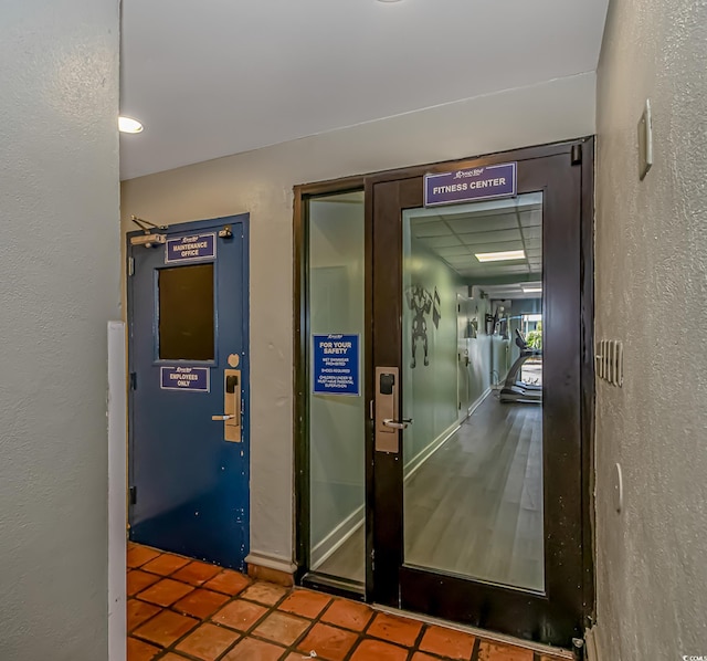 corridor featuring tile patterned floors