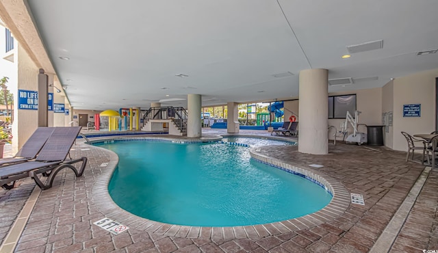 view of swimming pool featuring a patio area