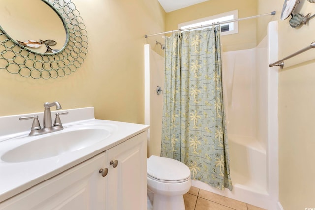 bathroom with toilet, a shower with curtain, vanity, and tile patterned floors