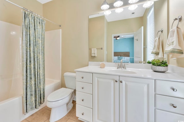 full bathroom with shower / tub combo, vanity, ceiling fan, tile patterned flooring, and toilet