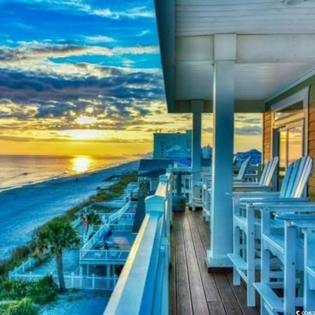 exterior space with a beach view and a water view