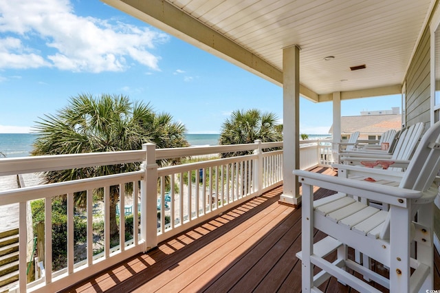 wooden terrace with a water view