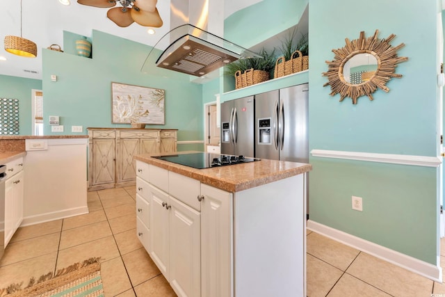 kitchen with a center island, white cabinets, black electric stovetop, decorative light fixtures, and island range hood