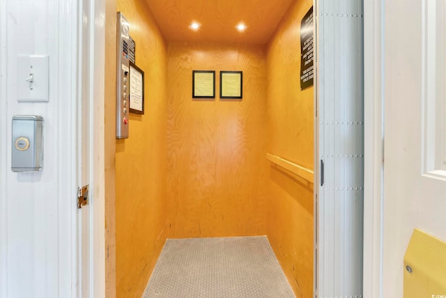 hallway featuring elevator