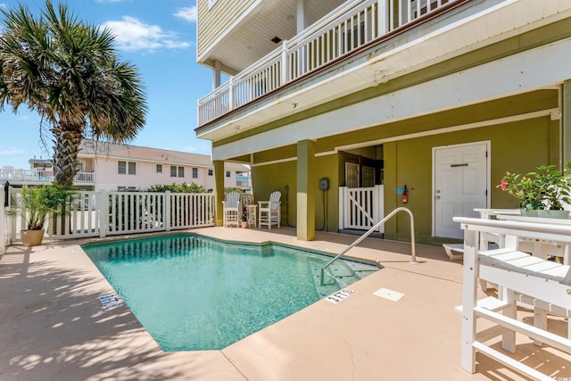 view of swimming pool with a patio area