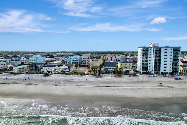 bird's eye view featuring a water view and a view of the beach