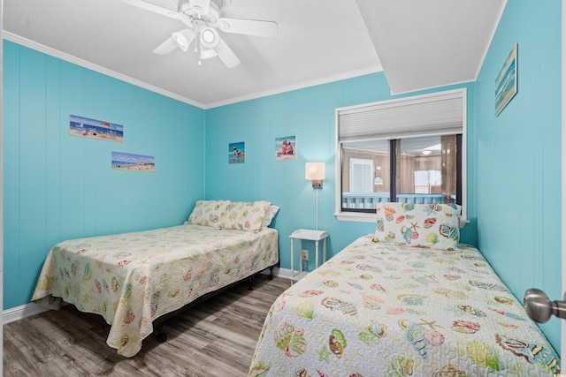 5601 N Ocean Blvd Unit C-305, Myrtle Beach, SC 29577 - bedroom featuring ornamental molding, wood finished floors, ceiling fan, and baseboards