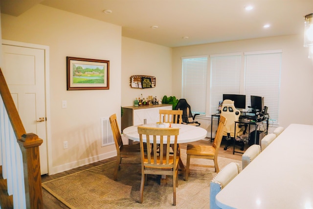 dining area with hardwood / wood-style flooring