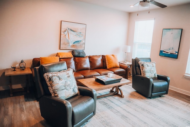 living room featuring hardwood / wood-style floors and ceiling fan