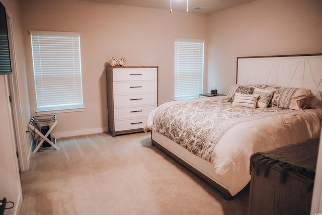 bedroom with light carpet