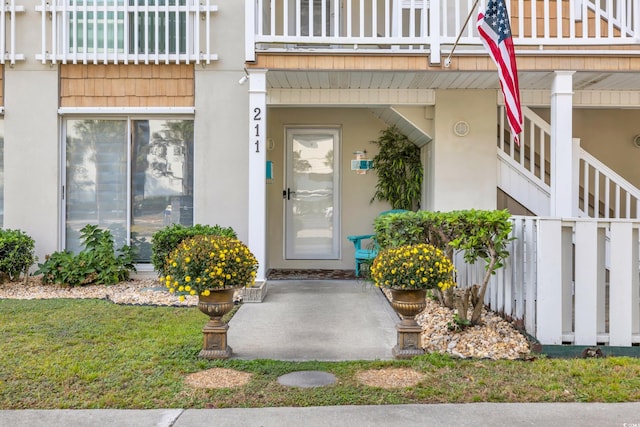 entrance to property with a balcony