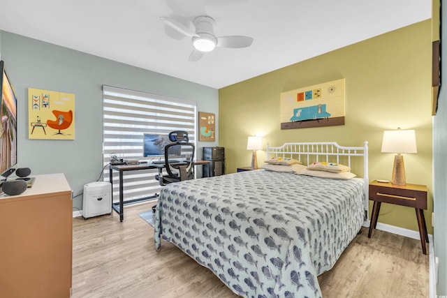 bedroom featuring light hardwood / wood-style floors and ceiling fan