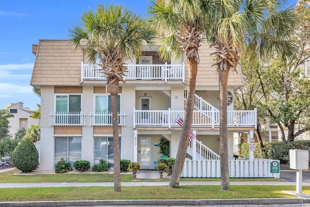 view of front of property with a balcony