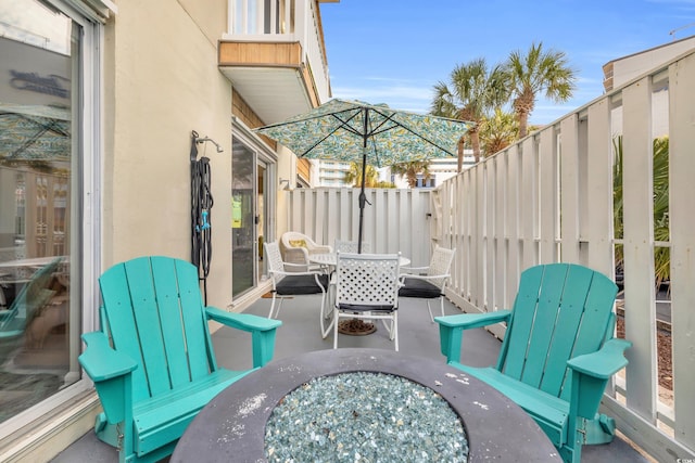 view of patio with a fire pit