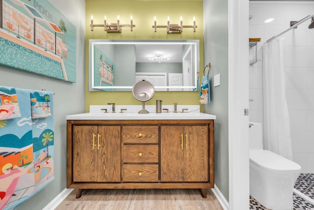 bathroom with hardwood / wood-style floors, vanity, toilet, and a shower with curtain