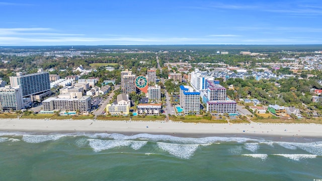 birds eye view of property with a beach view and a water view