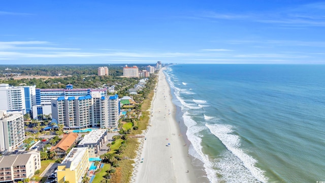 birds eye view of property with a beach view and a water view