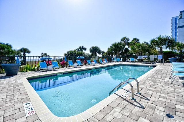 view of pool featuring a patio area