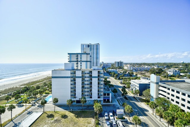 birds eye view of property featuring a view of the beach and a water view