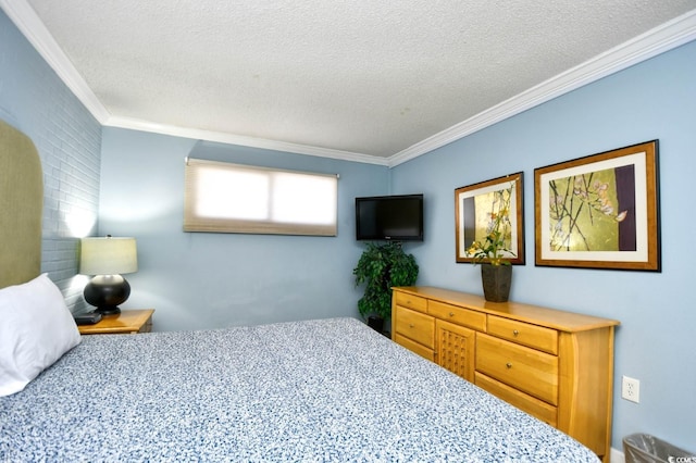 bedroom featuring carpet, ornamental molding, and a textured ceiling