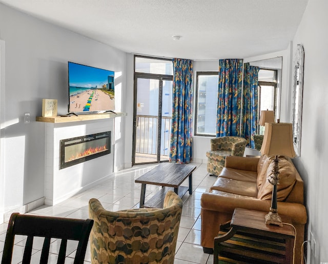 living room featuring light tile patterned floors and a textured ceiling