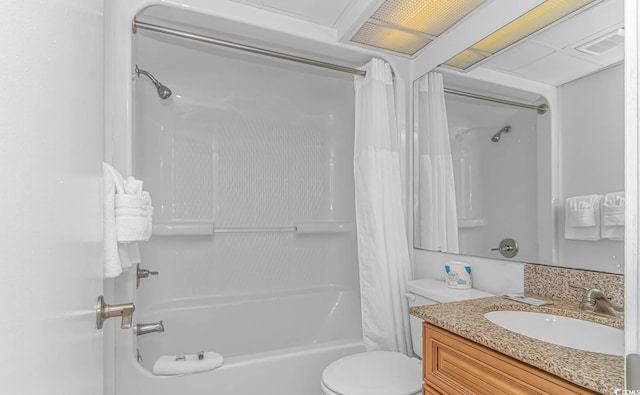 full bathroom featuring shower / tub combo with curtain, vanity, and toilet