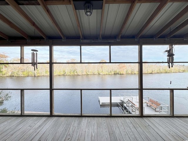 view of dock featuring a water view and a balcony