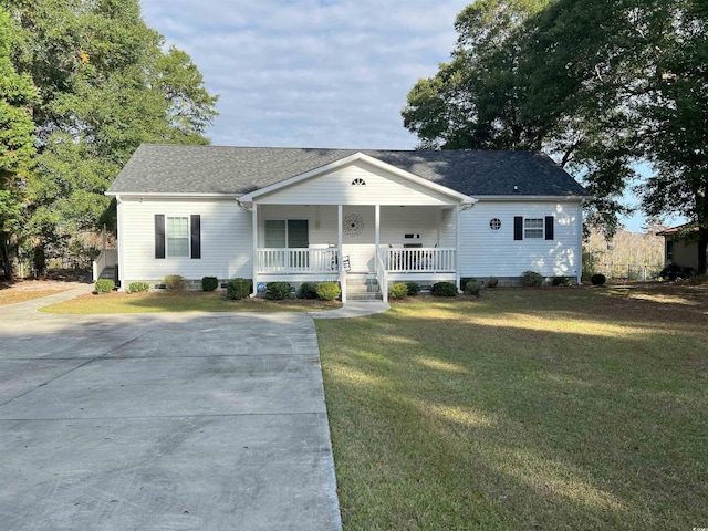 single story home featuring a front yard and covered porch